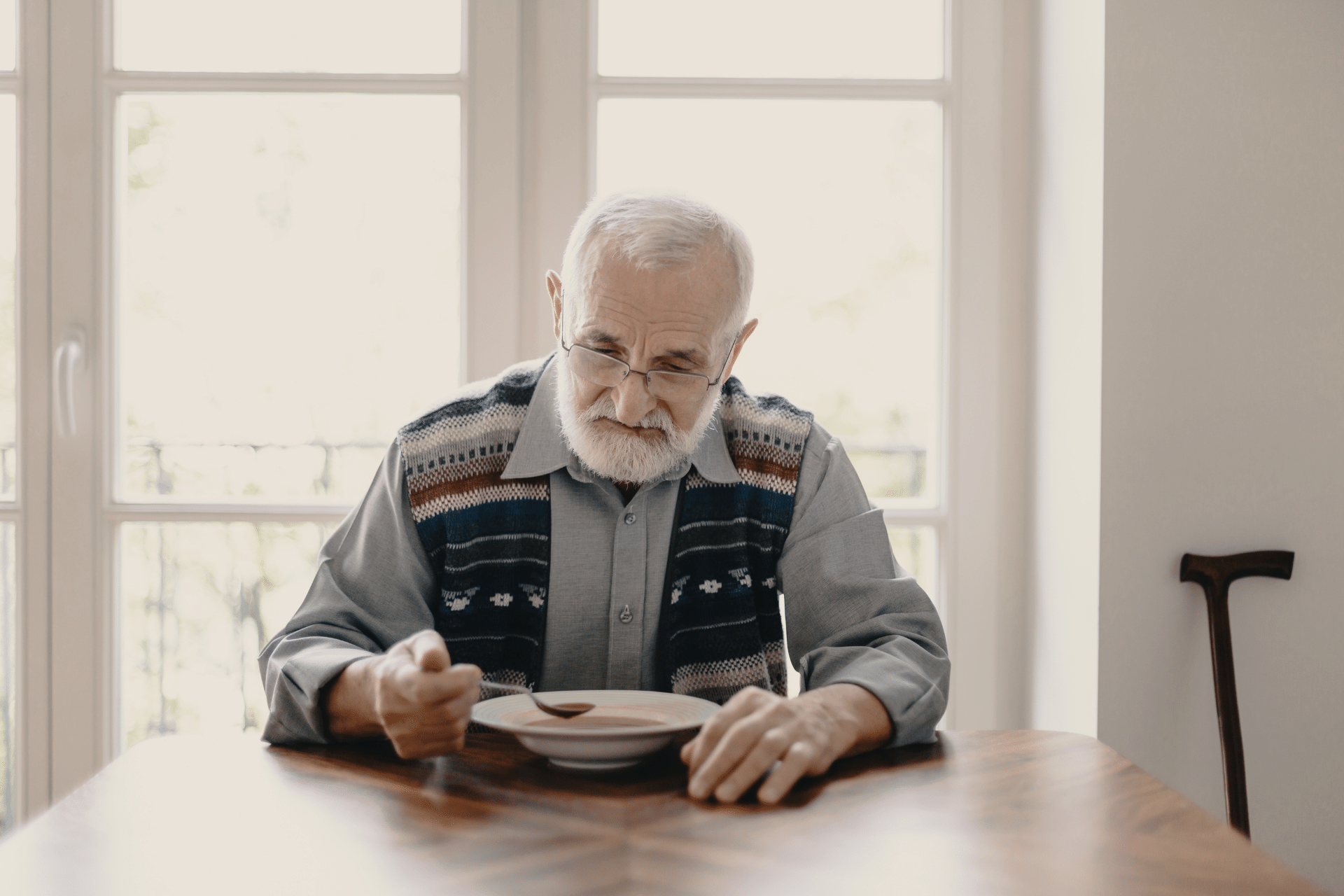 Senior man eating alone