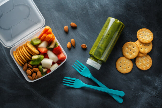 A lunch box with crackers and a bottle of juice, perfect for easy lunch recipes for CKD. A lunch box with crackers and a bottle of juice, perfect for easy lunch recipes for CKD.