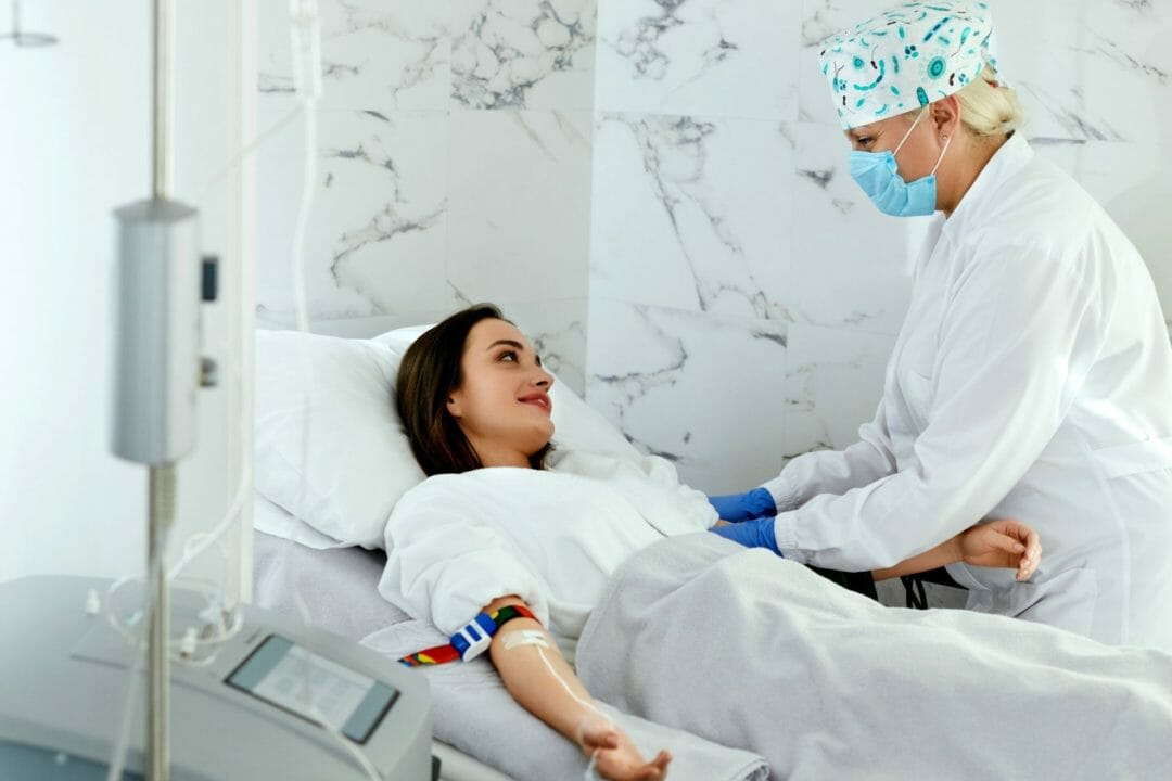 woman having hemodialysis in center