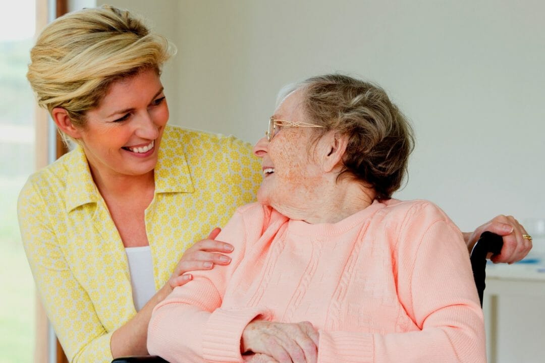 two females smiling Family members as Informal Caregivers