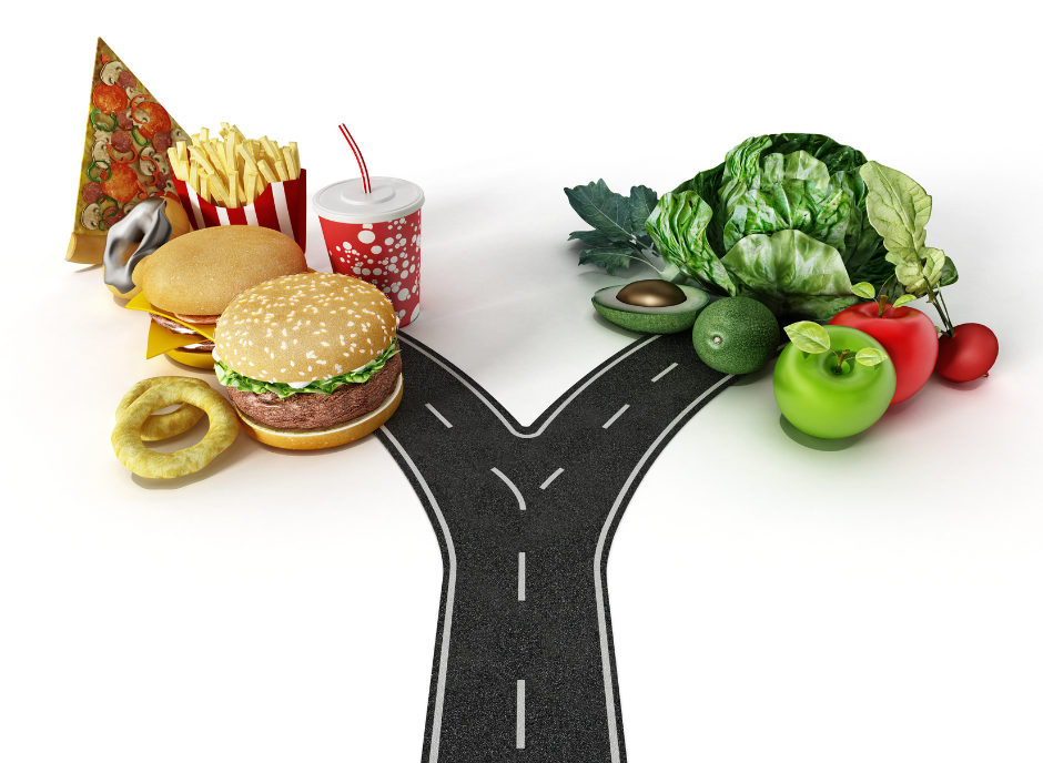 A road with burgers, fries and vegetables on it.