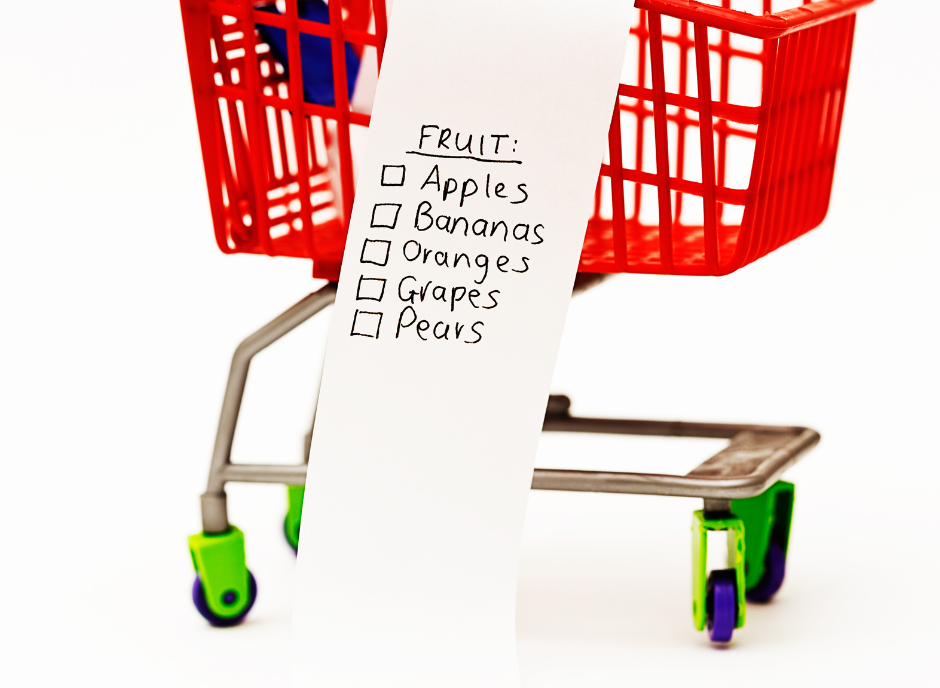 A shopping cart with a list of fruit on it.