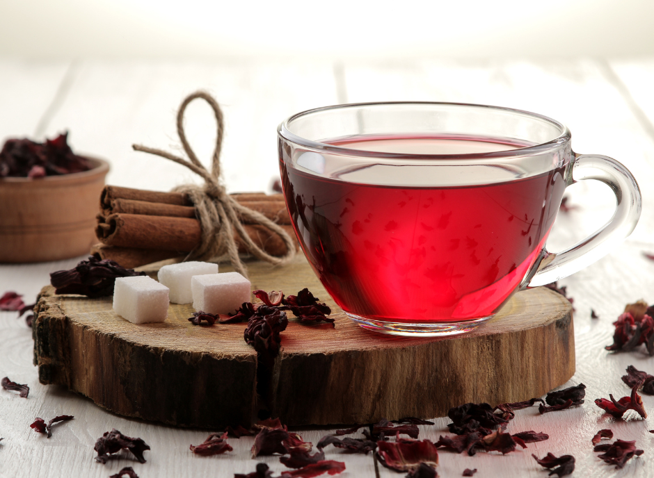 Red hibiscus tea with cinnamon and sugar, perfect for those looking for a kidney-friendly beverage option.