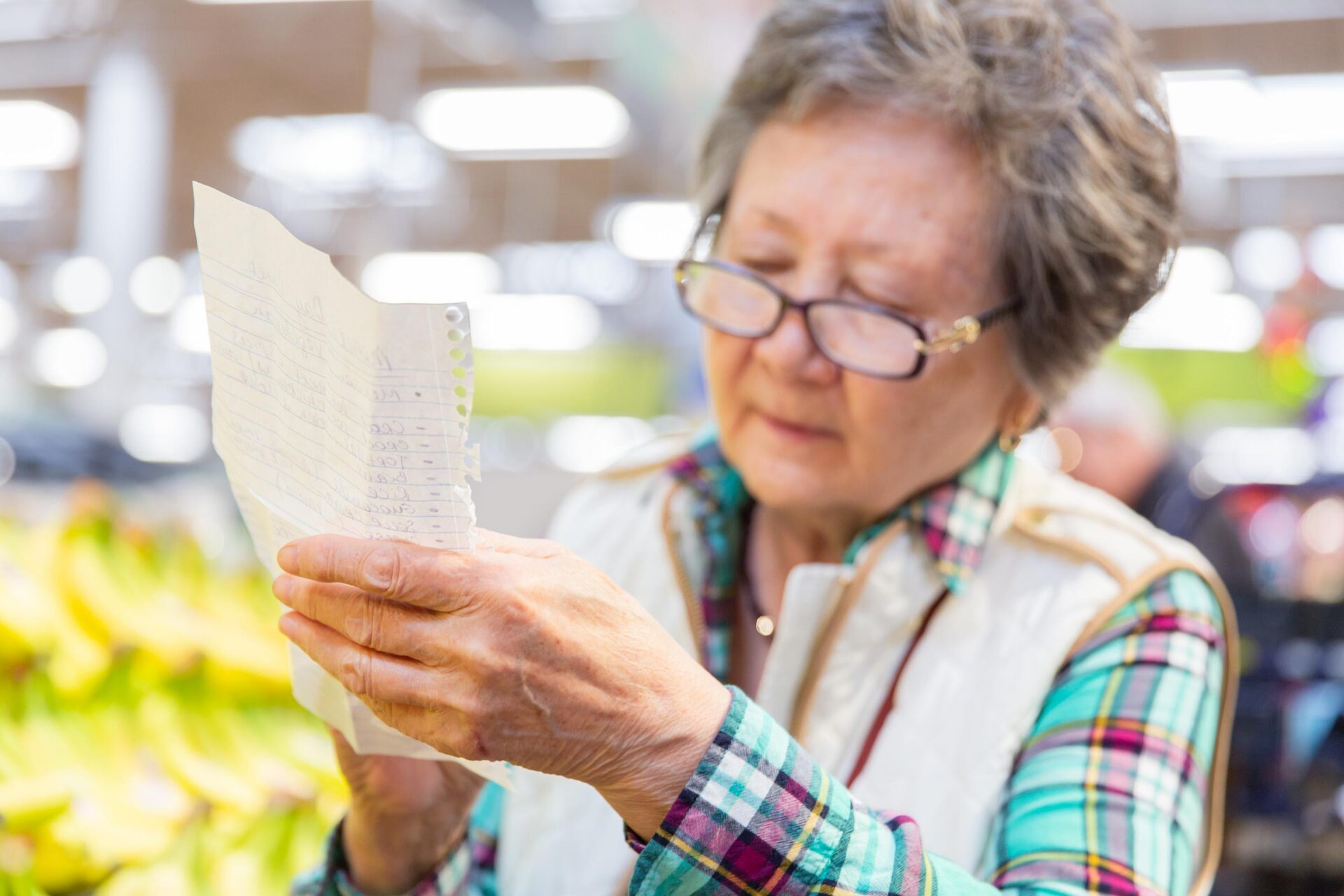 senior with grocery list